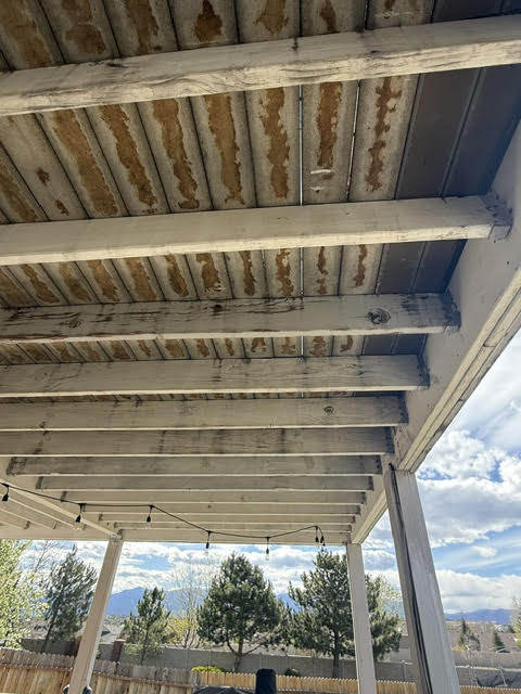 deck repair in Colorado Springs showing aging deck framing and structural deterioration