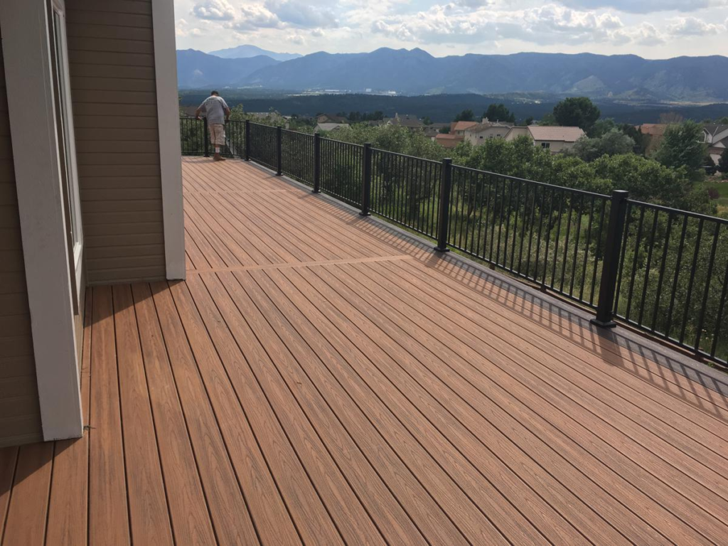 Composite deck with black metal railing overlooking the mountains in Colorado Springs
